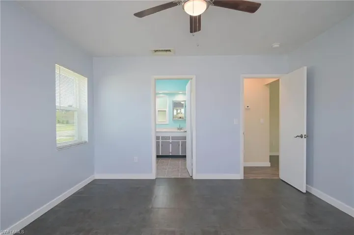 Spare room with ceiling fan