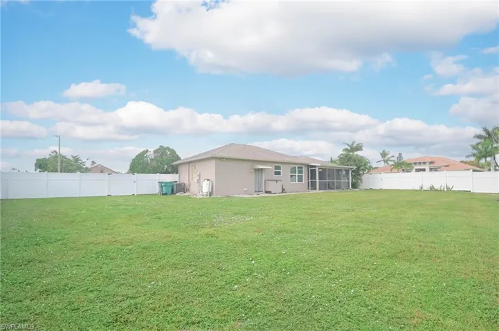 View of yard with a sunroom