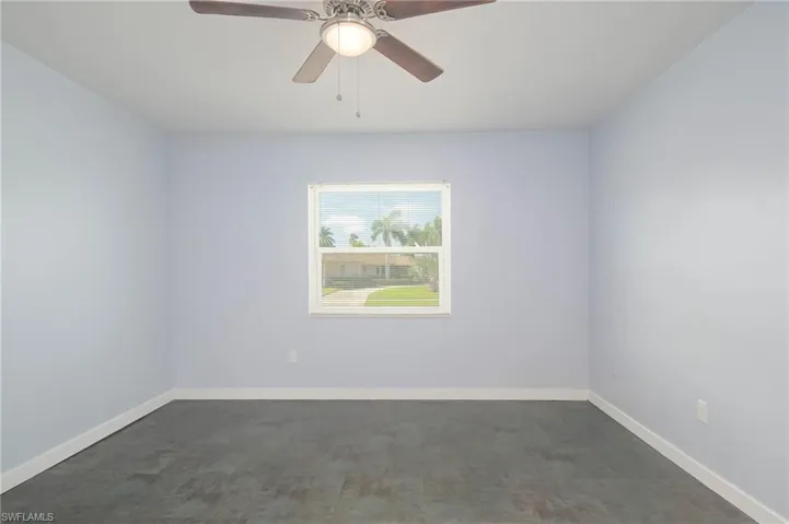 Empty room featuring ceiling fan