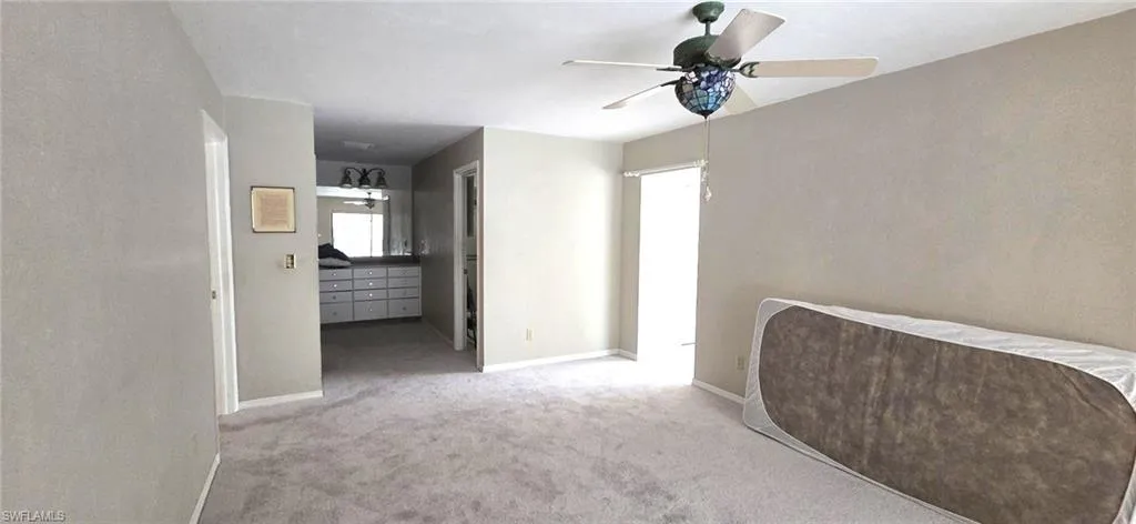Master bedroom with door on right, to den area