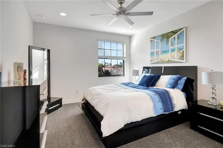 Bedroom featuring carpet, ceiling fan, and recessed lighting