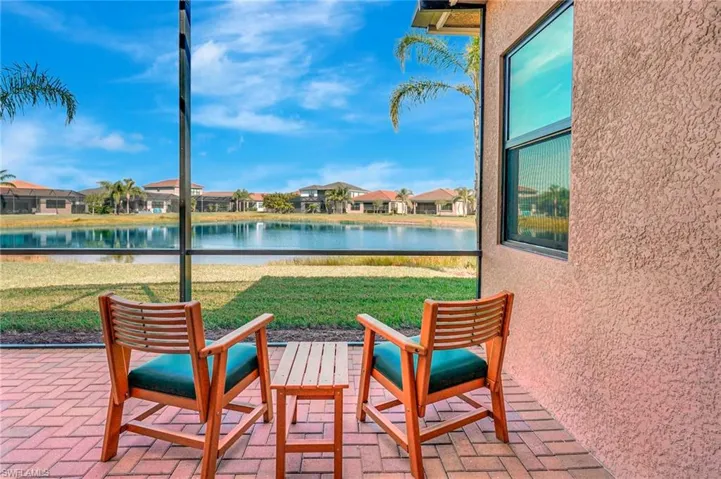 View of patio featuring a water view and a residential view
