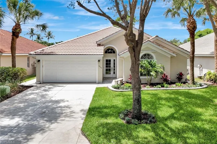 Exterior stucco finish with a tile roof