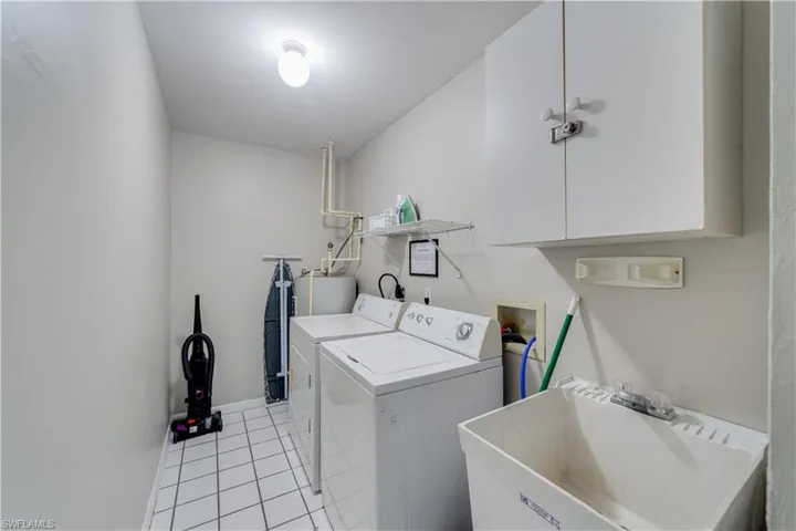 Inside laundry room with tub