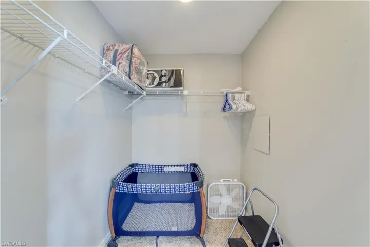 Walk-in closet in primary bathroom