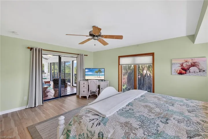 Light-filled primary suite offering serene tree-top views