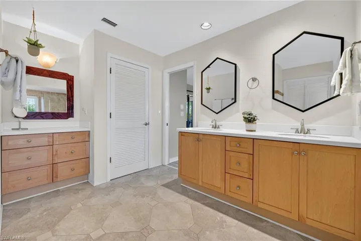 Double vanity and spa-style bath, large Walk-in closets and morning light everywhere