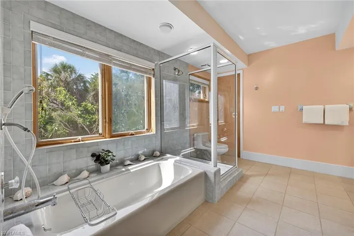 walls of windows, tranquil views, and a spa-inspired ensuite bath.