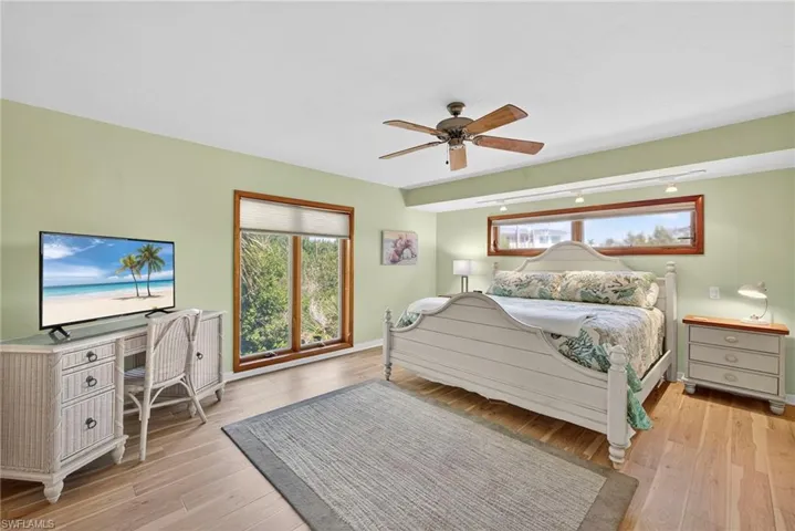 Primary bedroom 1 Wake up surrounded by nature in a light-filled primary suite that feels like a treehouse retreat.