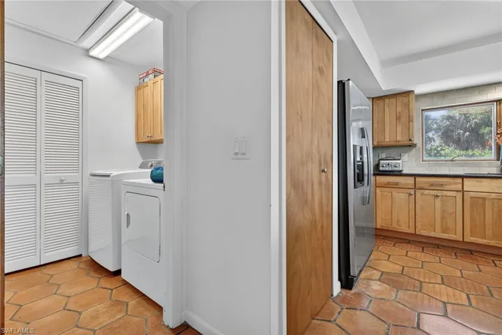 Large laundry room with plenty of storage.