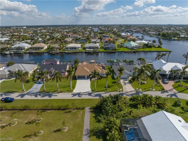 Drone / aerial view featuring a residential view and a water view