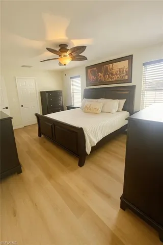 Bedroom featuring a ceiling fan and light wood finished floors