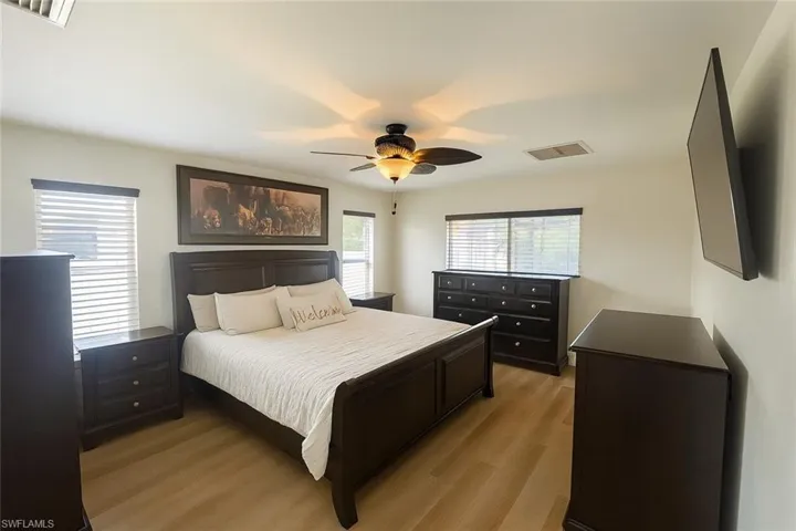 Bedroom featuring light wood-style floors and ceiling fan