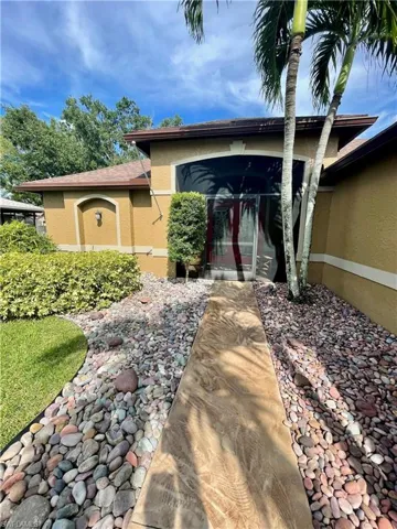 View of front of home featuring stucco siding