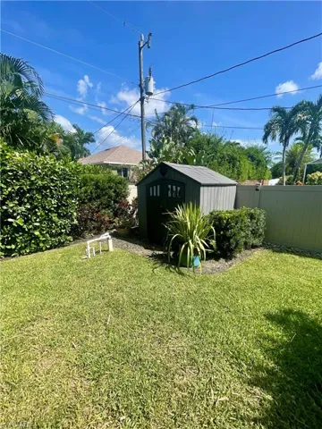 View of yard featuring a storage unit