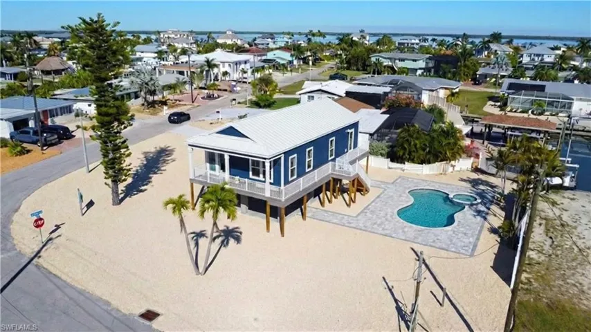 Aerial photo with residential area and Estero Bay - -VIRTUALLY EDITED