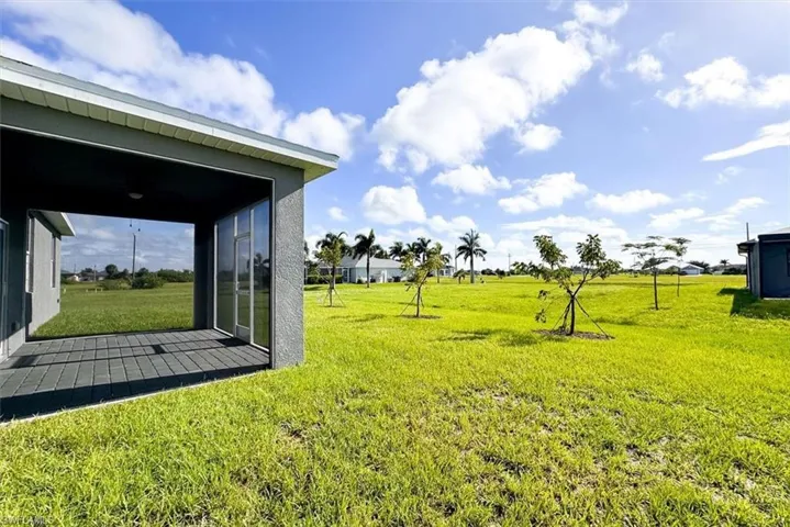 View of yard featuring a sunroom