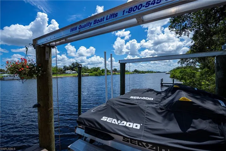 Dock area featuring a water view