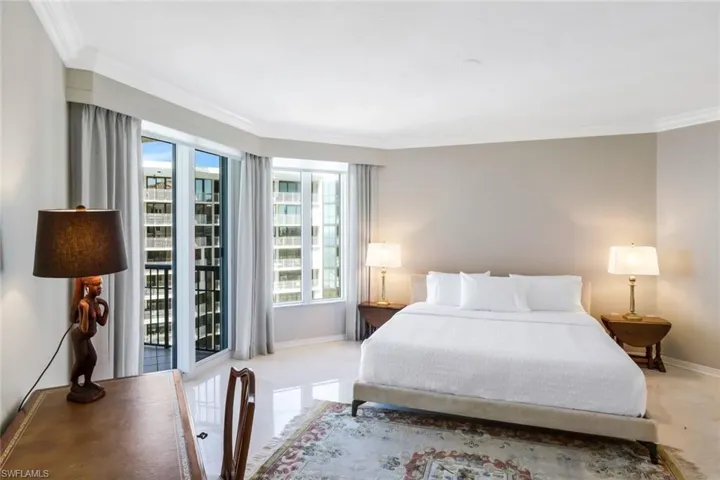 Large guest bedroom with balcony access and en suite bathroom