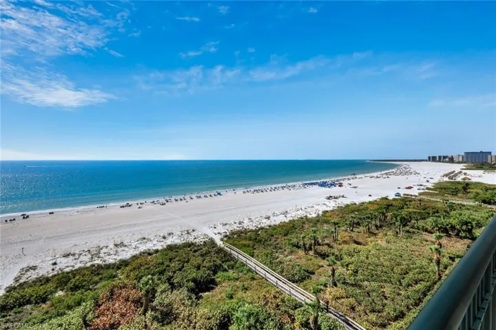 Dunnfoire #1002 has spectacular wide views of Marco Beach from an expansive balcony
