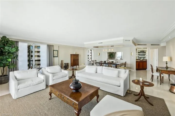 Large living room with views of beach and water