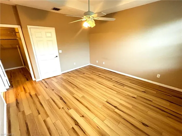 Unfurnished bedroom with light wood-type flooring and a ceiling fan