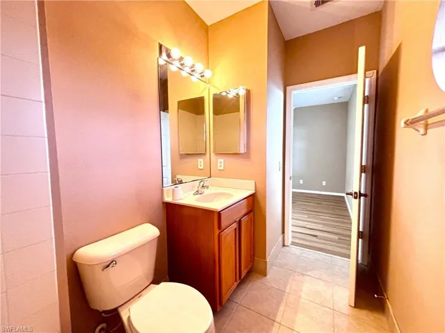 Bathroom with vanity and light tile patterned floors