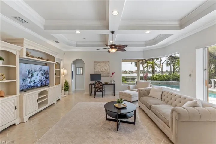 Family room with an awesome view of the pool and lake.