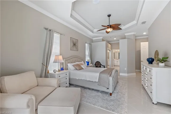 Primary bedroom with porcelain tile.   Gorgeous look!