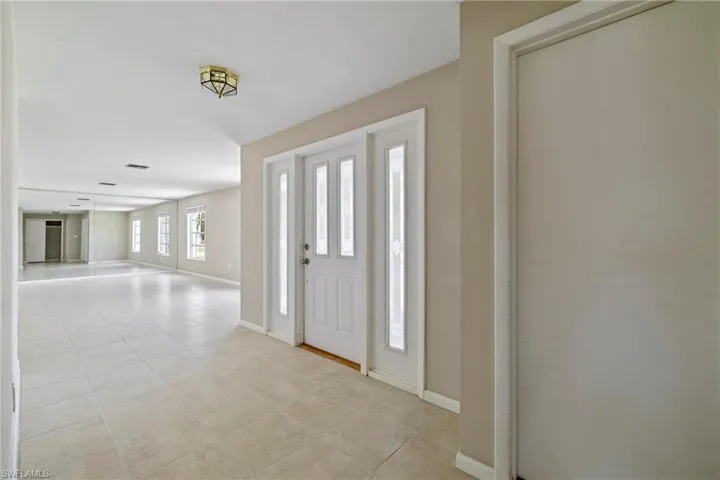 Entryway featuring light tile patterned flooring