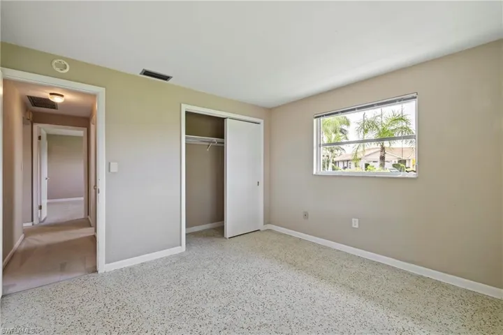 Unfurnished bedroom with a closet