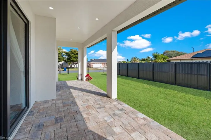 Fenced backyard featuring a patio