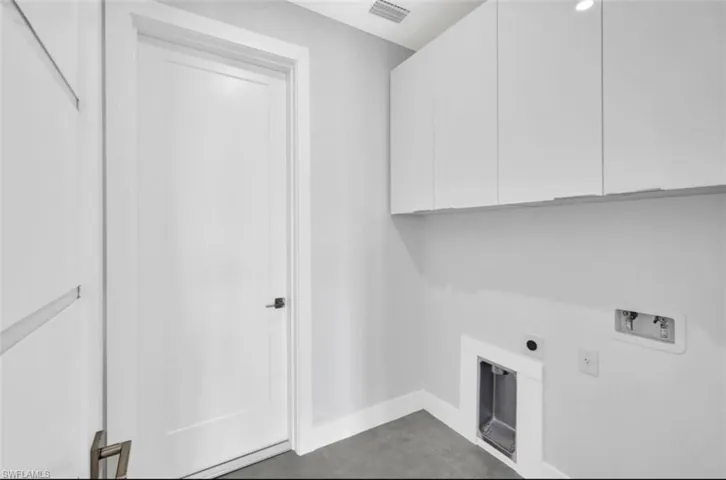 Washroom featuring washer hookup, cabinets, and hookup for an electric dryer
