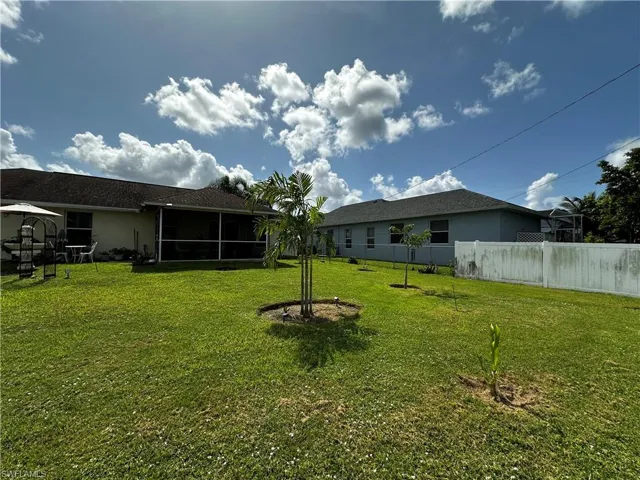 View of yard featuring a sunroom