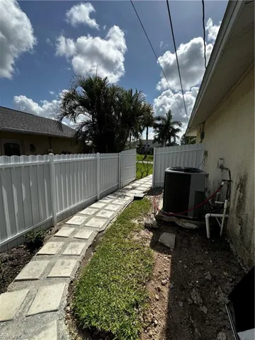 View of yard with cooling unit