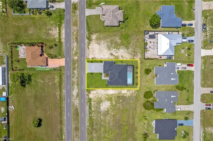 Aerial perspective of suburban area featuring property boundaries highlighted