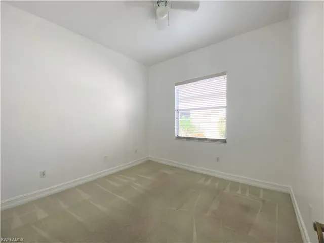Third bedroom with carpet and ceiling fan