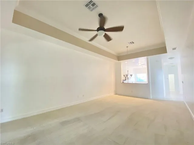 Living room with ceiling fan and carpet floors
