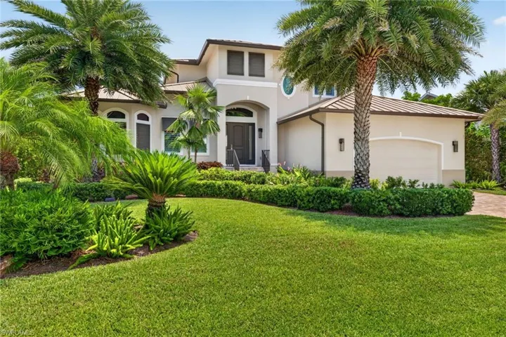 Stucco exterior with a tiled roof and arched windows