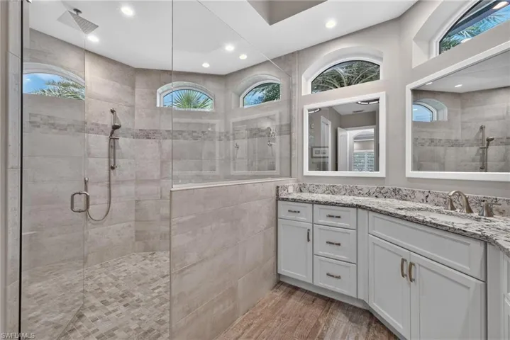 Primary Bathroom walk-in shower with clear glass enclosure and rainfall showerhead