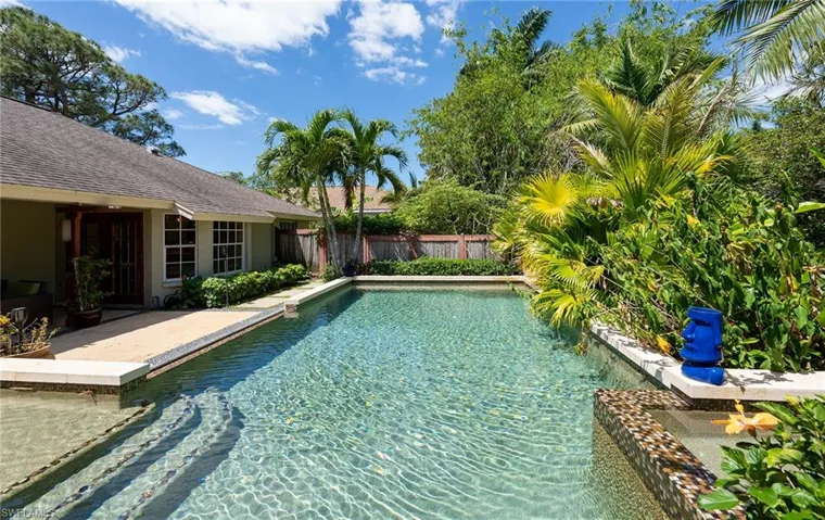 View of swimming pool with a fenced backyard and a patio