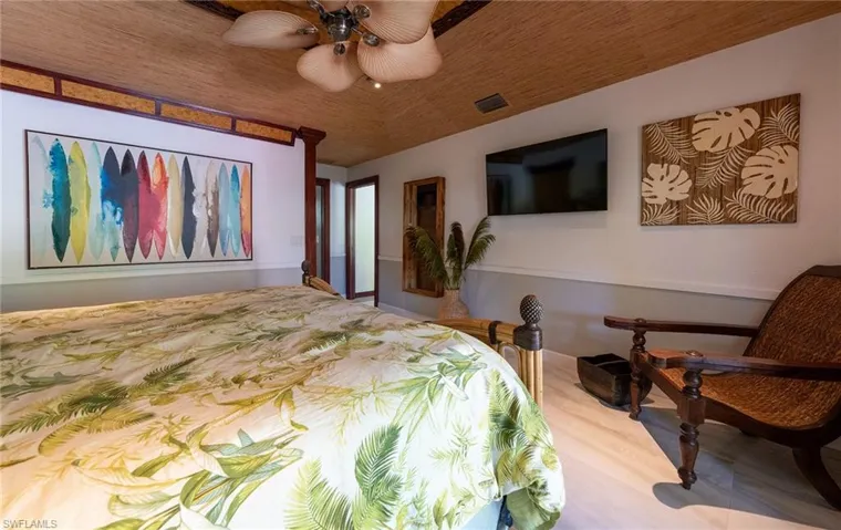 Bedroom featuring wood finished floors and a ceiling fan