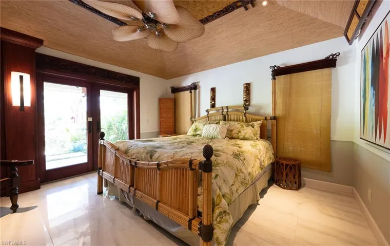 Bedroom with access to outside, french doors, and a ceiling fan