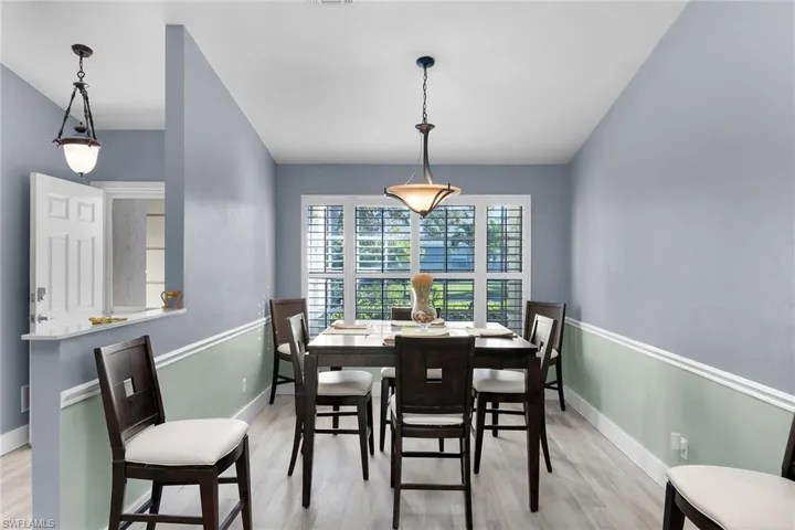 Dining room featuring light wood finished floors and baseboards