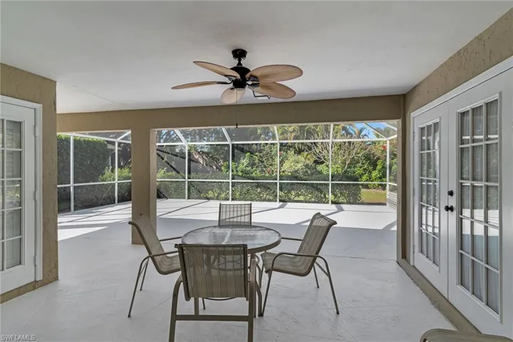 Sunroom featuring a patio, french doors, and a ceiling fan