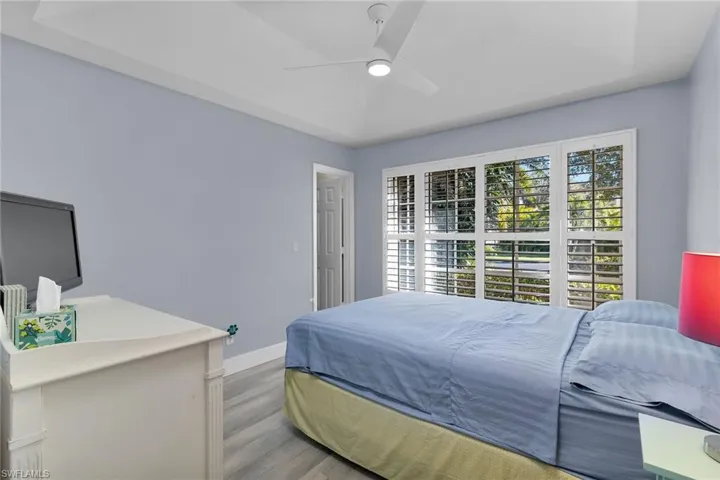 Bedroom featuring wood finished floors and ceiling fan