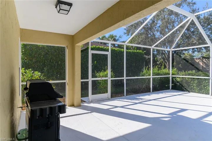 Sunroom / solarium featuring a patio