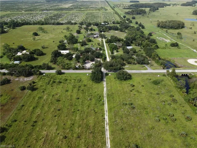 Birds eye view of property featuring a rural view