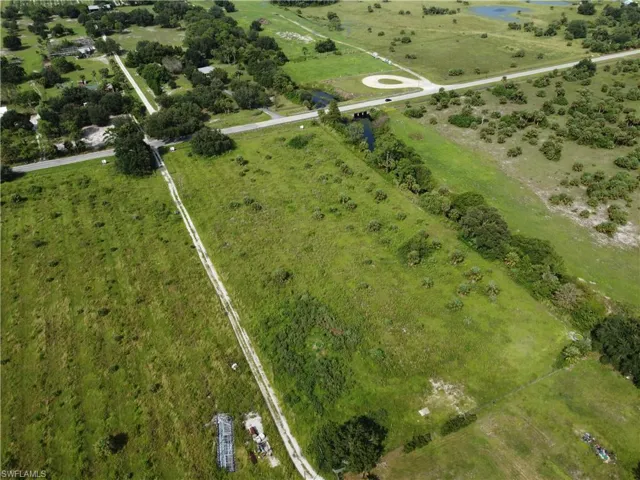 Birds eye view of property with a rural view