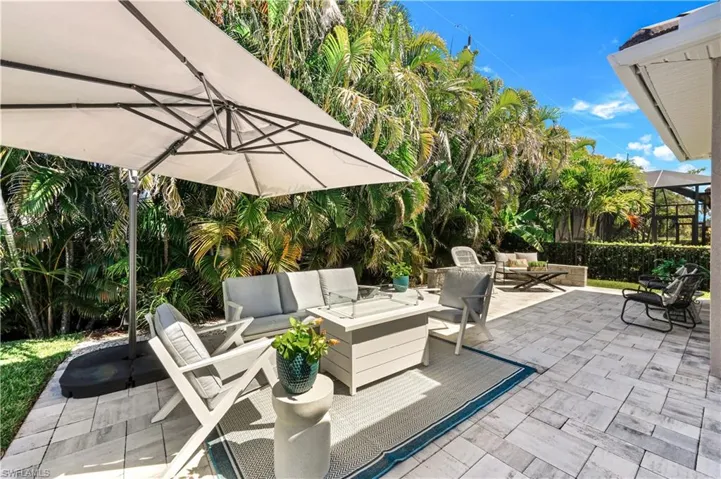 View of patio featuring an outdoor living space with a gas fire pit.